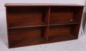 An early 20th century solid oak open window bookcase cabinet of wide proportions having 4 shelves.