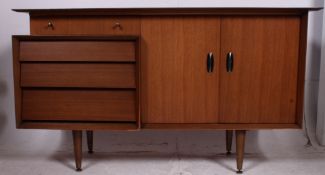 A good 1970's teak wood break front sideboard by Beautility raised on tapered supports with an