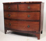A 19th century Georgian mahogany bow front chest of drawers raised on french kick legs with 2 short