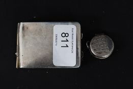 A vintage silver locket along with a silver card case 37.