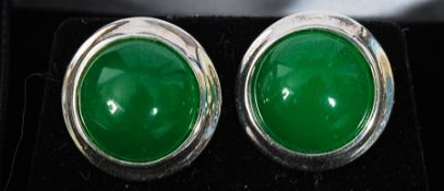 A pair of silver and jade cabochon set stud earrings. Measures: 4g.