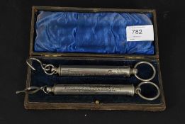 A cased set of twin silver plated 19th century Salter scales complete in the leather lined