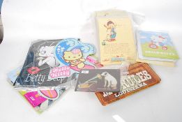 A collection of vintage metal signs to include Hello Kitty, Betty Boop, Beatles,