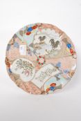 A 20th century large Chinese Imari wall charger having famille rose sectional design,