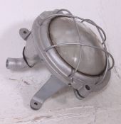 A 20th century retro heavy Industrial oval bulkhead light with fish eye clear glass.