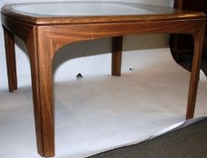 A 1960's teak atomic style retro coffee table of square form with inset circular glass top being