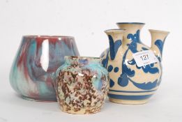 An Aller Vale crocus vase together with a Ewenny pottery style studio vase and another ( see