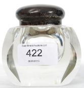 A silver hallmarked and cut glass inkwell.