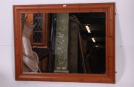 A large 20th century John Lewis pine overmantel mirror. The squared frame with central set mirror.