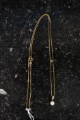 A 375 marked 9ct gold box chain having pearl pendant applied, weight 3.