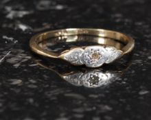 A ladies 9ct gold diamond chip ring, weight 1.g size M.