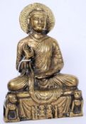 A good early 20th century brass figure of deity /  Buddha raised on square plinth with fu-dogs