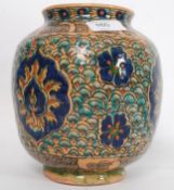 A 19th century Iznik style Persian / Turkish vase having scroll design to the bulbous body having