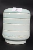A Susie Cooper 1930's Art Deco blue glazed cylindrical vase with ribbed edge bearing incised Susie
