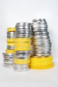 A large collection of vintage metal faux camera film tins to include plain and painted yellow in