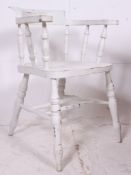 A 20th century Antique style painted shabby chic smokers bow Windsor armchair raised  on turned