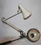 A Vintage Herbert Terry anglepoise lamp raised on terraced circular base with pendant shade