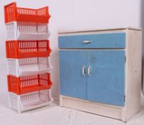 A vintage / retro kitchen dresser unit along with a retro plastic stacking vegetable organiser.