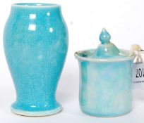 A Ruskin pottery blue glazed Solifleur vase of compressed bulbous form together with a similar blue