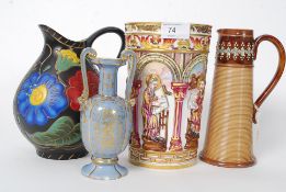 A collection of ceramics to include a Doulton Lambeth stoneglazed jug, Italian classical scene vase,