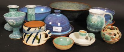 A collection of contemporary glazed studio pottery, dishes fruit bowls, mugs,