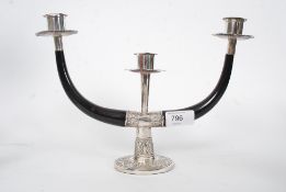 A Siamese silver and horn 3 prong candelabra.