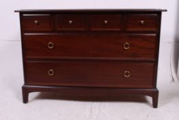 A Stag mahogany ' Minstrel ' chest of drawers raised on squared tapered supports having short over