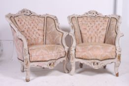 A pair of early 20th century Shabby chic rococo painted armchairs.