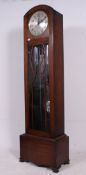 A tall 1930's Enfield Westminster chiming longcase clock.