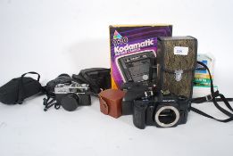 A collection of vintage cameras to include Kodak Brownie, Olympus 33, Kona Attic,