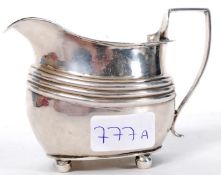 A 19th century Georgian silver hallmarked creamer of unusual form bearing hallmarks for London 1808