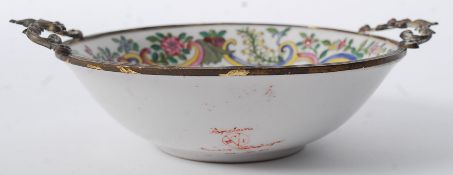 An 18th century French porcelain bowl / dish having ormulu metal embellished rim and pierced