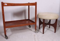 A retro 1970's teak Danish style buffet tea trolley together with a cream faux leather circular