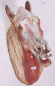 A good 20th century painted shabby chic large cast horses head, possibly ex-fairground / carnival.