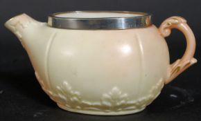 A 19th century Locke & Co Worcester ivory blush creamer having a silver hallmarked rim dating to