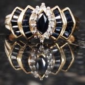 A 9ct gold sapphire and diamond ring. Measures: 3.4g size O.