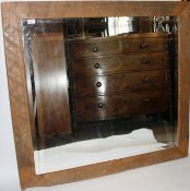 A large heavy rustic oak framed 20th century wall mirror,