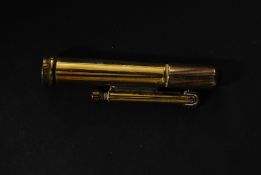 A good vintage early 20th century brass flint lighter in the shape of a bullet