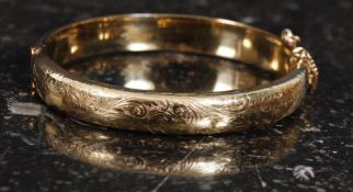 A good quality 20th century decorative ladies rolled gold bangle , weight 15.