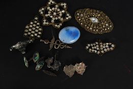 A collection of silver and costume jewellery to include Victorian filligree brooches, pendants,
