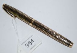 A fabulous 14ct gold nib Sheaffer fountain pen having criss cross pattern case and cap being 14ct