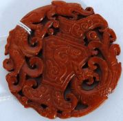 A carved Jade roundel having fret pierce