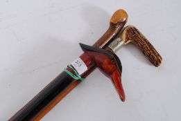 Three walking sticks to include horn han