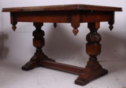 A 1930's Art Deco carved oak draw leaf d