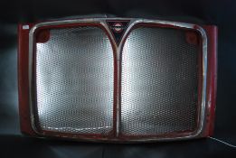 An original front grille panel from a Lo