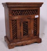 A decorative hardwood Indian hanging cab