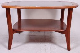 A Vintage Teak circular coffee table wit