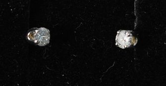 A pair of white gold diamond stud earrin