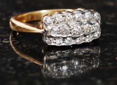 An 18ct gold and diamond ring. The mount