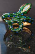 A decorative Betty Johnson costume jewellery bracelet being enamel set in the form of a serpent.